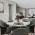 a living room with a table and chairs