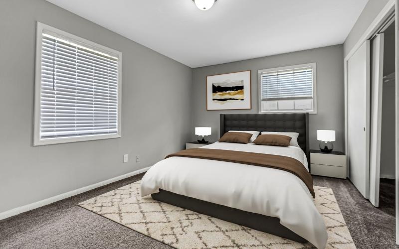 a bedroom with a bed and a lamp