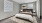 a bedroom with a bed and a lamp