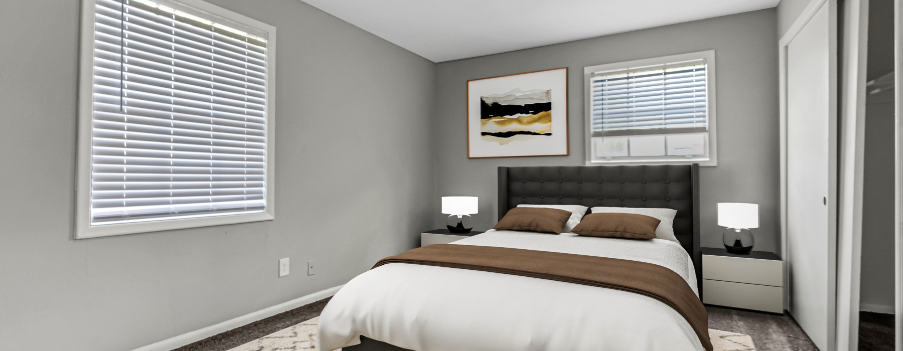 a bedroom with a large bed and a window
