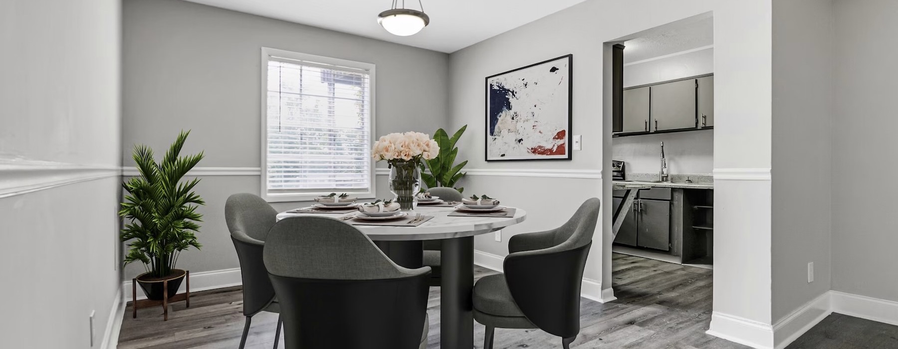 a dining room with a table and chairs