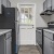 a kitchen with white cabinets