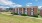 a brick building with a lawn