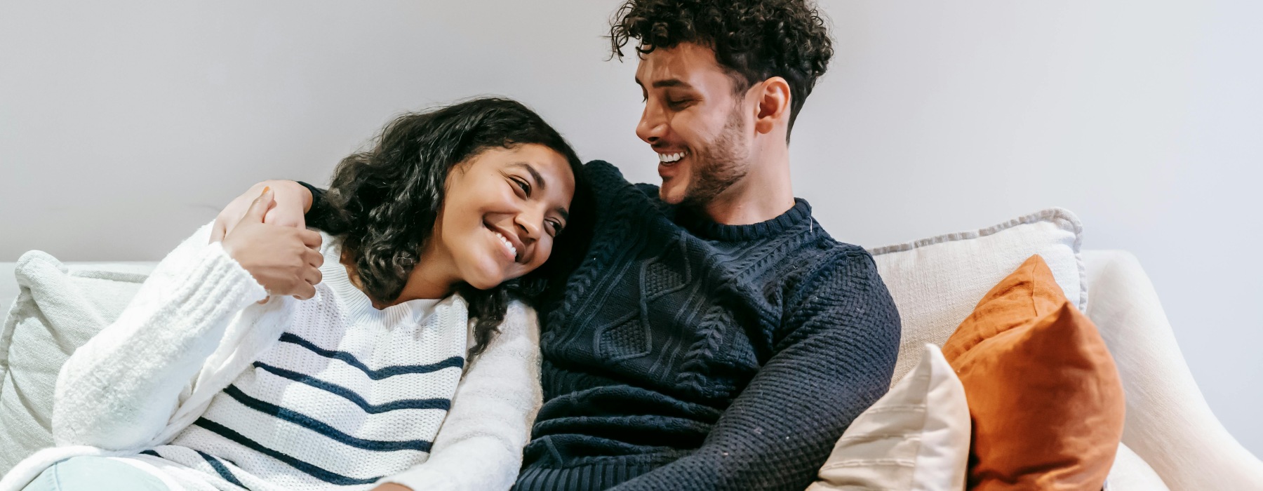 a couple sitting on a couch