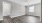 a room with a wood floor and white walls